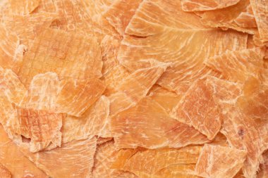 A group of tasty beer snacks. Dehydrated chicken meat slices. 