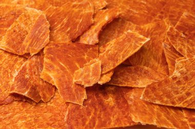 A group of tasty beer snacks. Dehydrated chicken meat slices. 