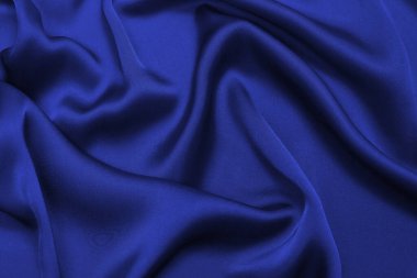 Zengin ve lüks kırmızı ipek kumaş dokusu. Üst görünüm.