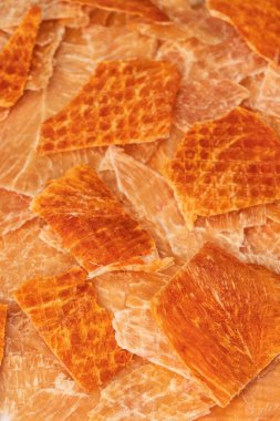 A group of tasty beer snacks. Dehydrated chicken meat slices. 