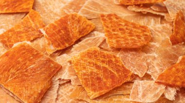 A group of tasty beer snacks. Dehydrated chicken meat slices. 