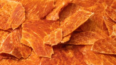 A group of tasty beer snacks. Dehydrated chicken meat slices. 