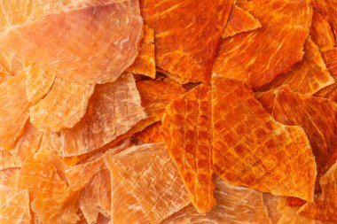 A group of tasty beer snacks. Dehydrated chicken meat slices. 