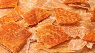 A group of tasty beer snacks. Dehydrated chicken meat slices. 