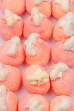 Orange marshmallow candy isolated on a white background. 