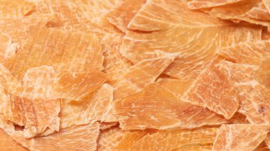 A group of tasty beer snacks. Dehydrated chicken meat slices. 