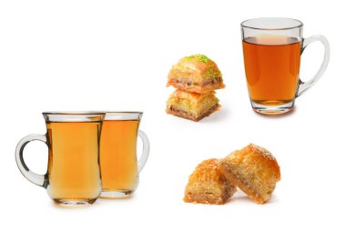 Beyaz zemin üzerinde Türk çayı bulunan Türk tatlı baklavası.