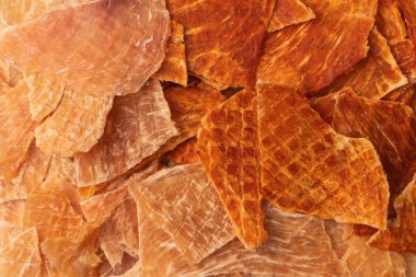 A group of tasty beer snacks. Dehydrated chicken meat slices. 