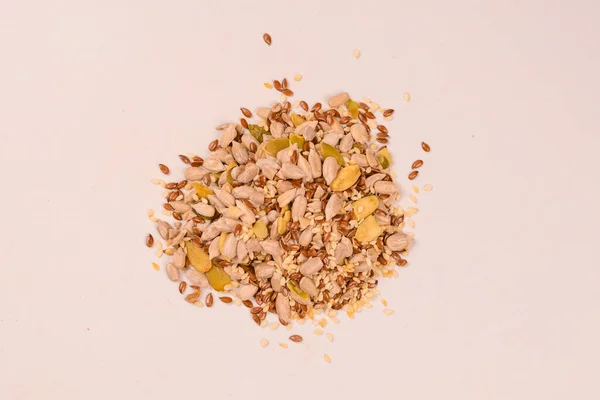 Mix of seeds for a salad. A pile of mixed seeds isolated on a white background.