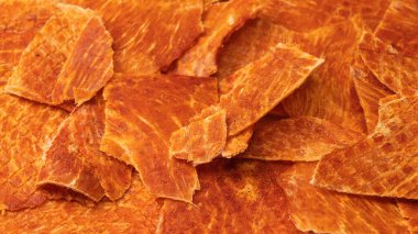 A group of tasty beer snacks. Dehydrated chicken meat slices. 