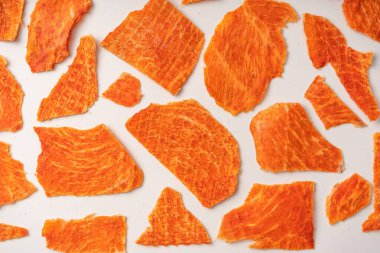 A group of tasty beer snacks. Dehydrated chicken meat slices. 