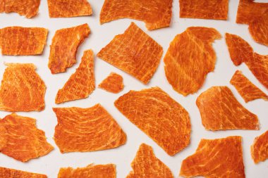 A group of tasty beer snacks. Dehydrated chicken meat slices. 