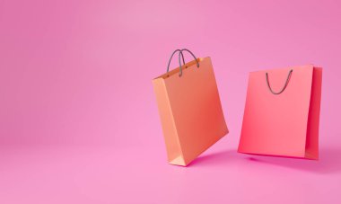 Pembe arka planda 3 boyutlu resimli kağıt poşetler izole edilmiş. Çevrimiçi alışveriş kavramı. 