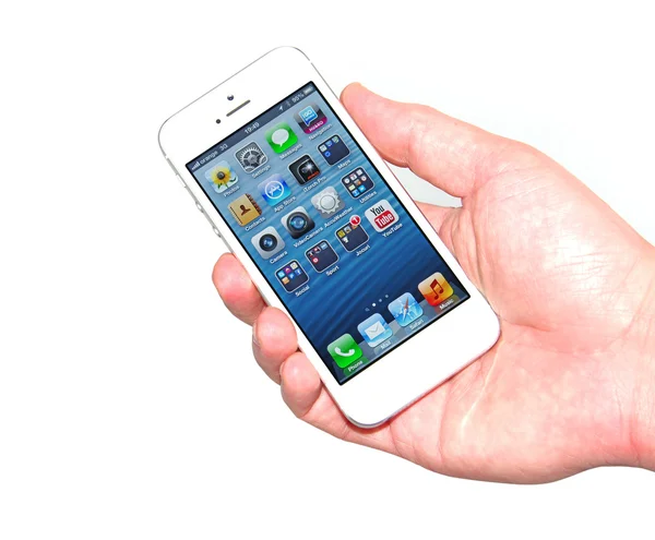 Hand holding new iPhone 5 — Stock Photo, Image