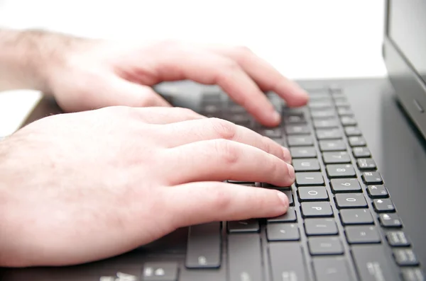 Hand on laptop keyboard — Stock Photo, Image