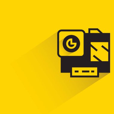 action camera with shadow on yellow background