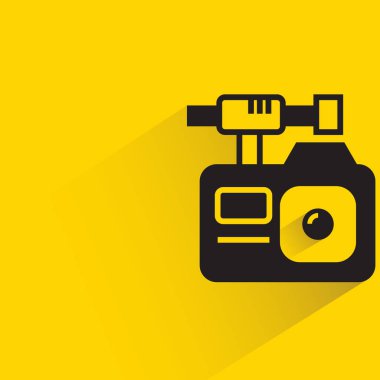 action camera with shadow on yellow background