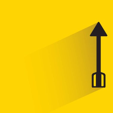 arrow with shadow on yellow background