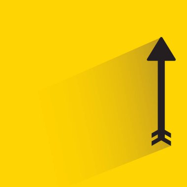 arrow with shadow on yellow background