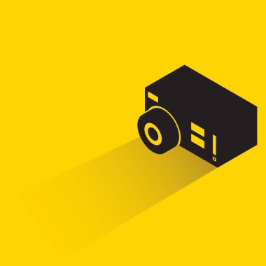 action camera with shadow on yellow background