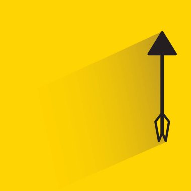 arrow with shadow on yellow background