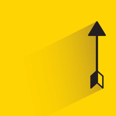 arrow with shadow on yellow background