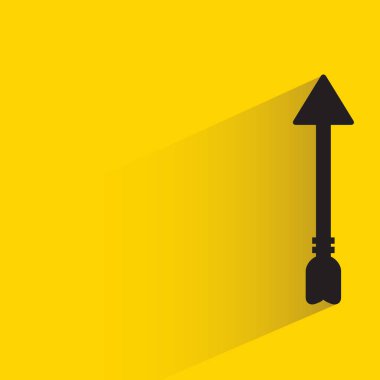 arrow with shadow on yellow background