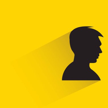 male face with drop shadow on yellow background