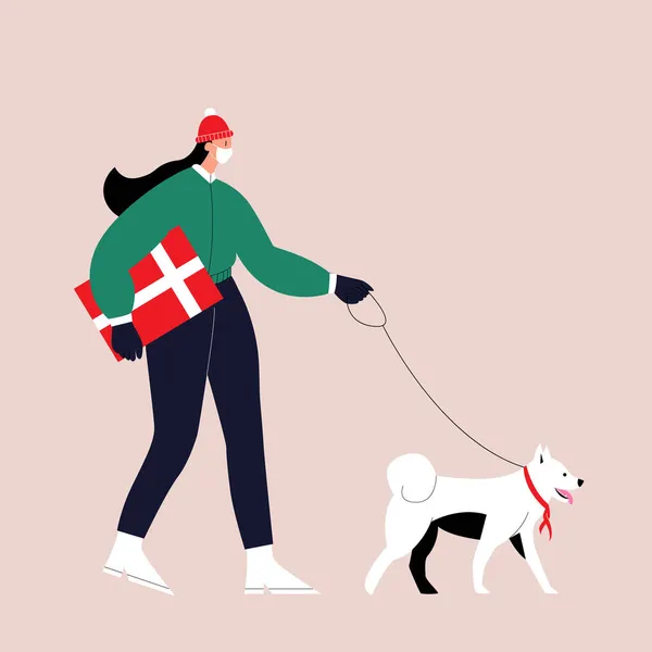 Una niña con ropa de invierno y una máscara médica en la cara con un regalo en las manos pasea con un perro con una bufanda alrededor de su cuello. El concepto de la preparación para las vacaciones, Navidad, Año Nuevo. — Vector de stock