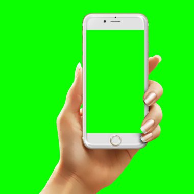 Hand holding phone with green background