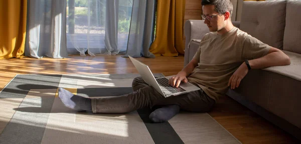 Banner Young Man Sitting Computer Working Floor Sunny Loft Apartment — Stock Photo, Image