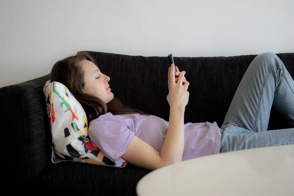 Everyday Routine Young Woman Using Her Phone Sofa Morning — Stock Photo, Image