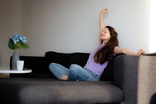 Young Woman Sitting Sofa Balcony Stretching Morning — Stock Photo, Image