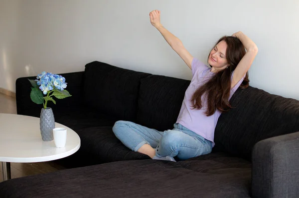 Young Woman Sitting Sofa Stretching Morning — Stock Photo, Image