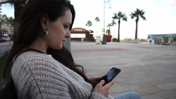 Young Woman Using Smartphone Outdoors Sea Palm Trees Background — Video