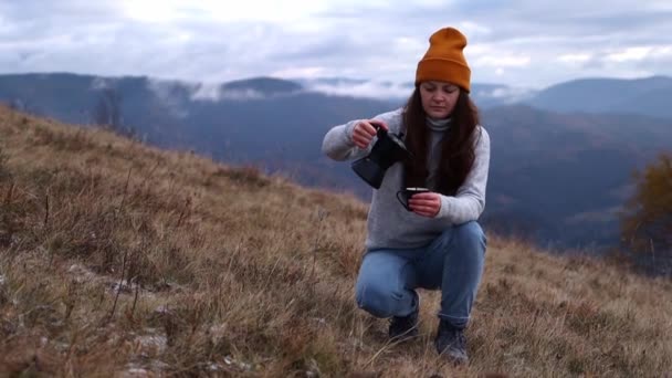 Woman Orange Beanie Hat Pouring Out Coffee Moka Pot Cup — Stockvideo