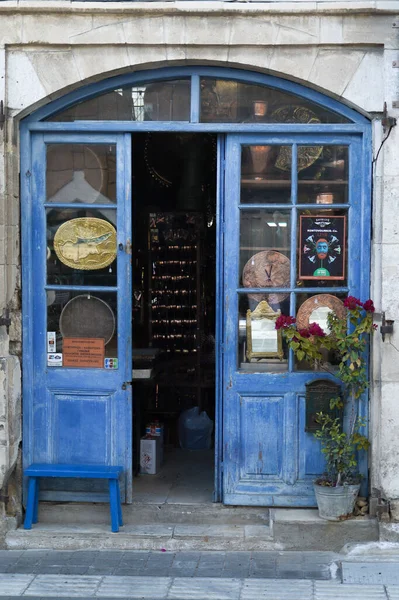 Old shop with handmade decorative clocks and other craft things from metal, copper, or iron Larnaca, Cyprus.