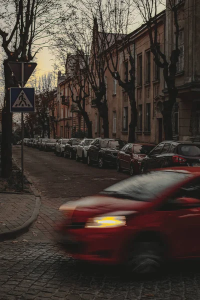 Beautiful tiny street in Lviv. Car movement of the foreground