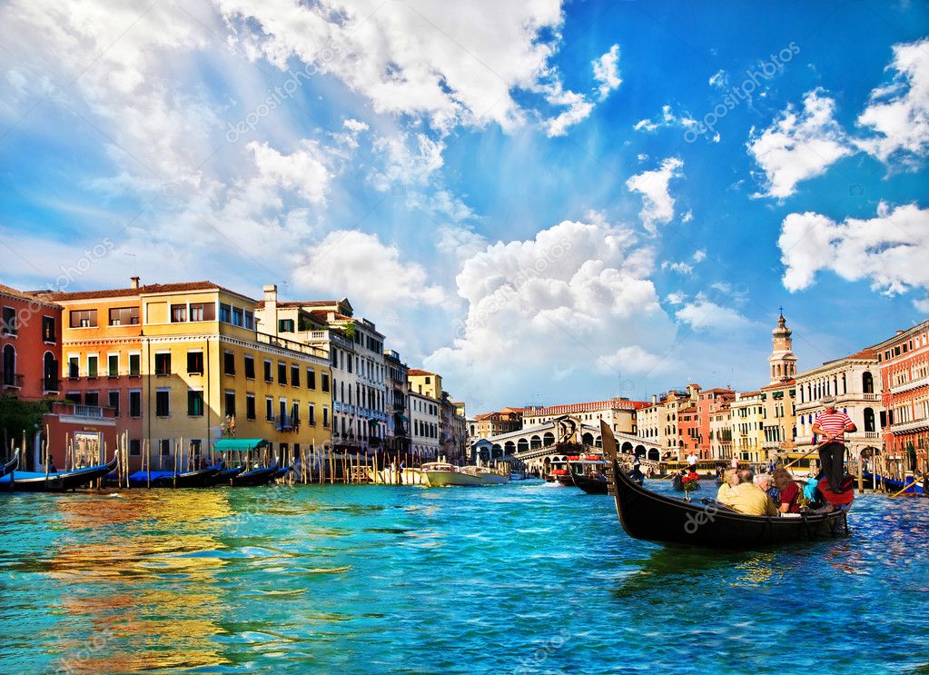 Venice Grand canal with gondolas and Rialto Bridge, Italy