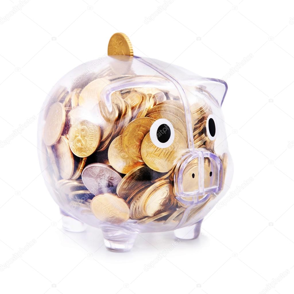 Savings in piggy bank isolated on white background