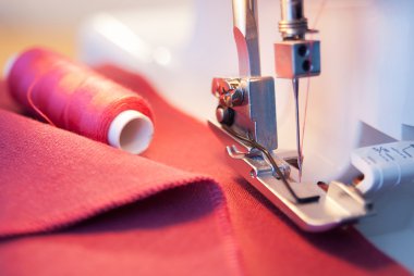 sewing process in the phase of overstitching clipart