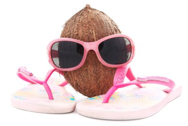 coconut concept for travel agency with sunglasses and beachwear clipart
