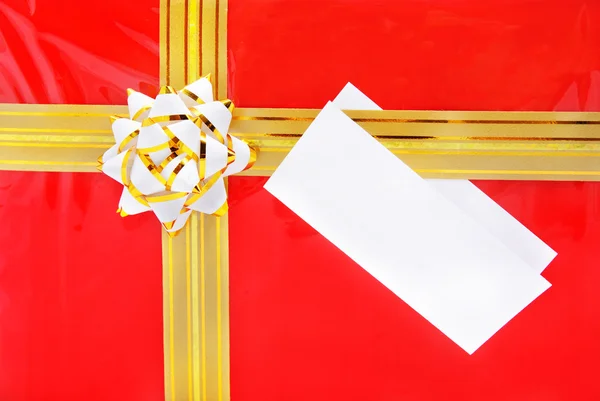 Single red gift box with golden ribbon and the close up of white — Stock Photo, Image