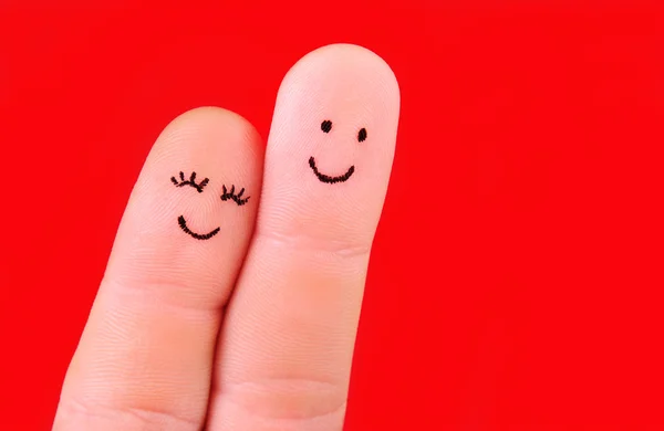 Concepto de pareja feliz - un hombre y una mujer abrazo, pintado en los dedos — Foto de Stock