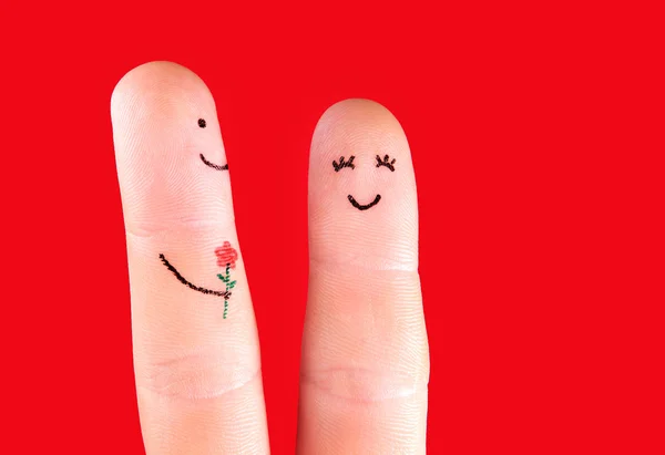 Concetto di coppia felice - un uomo con fiore e una donna, dipinto a — Foto Stock