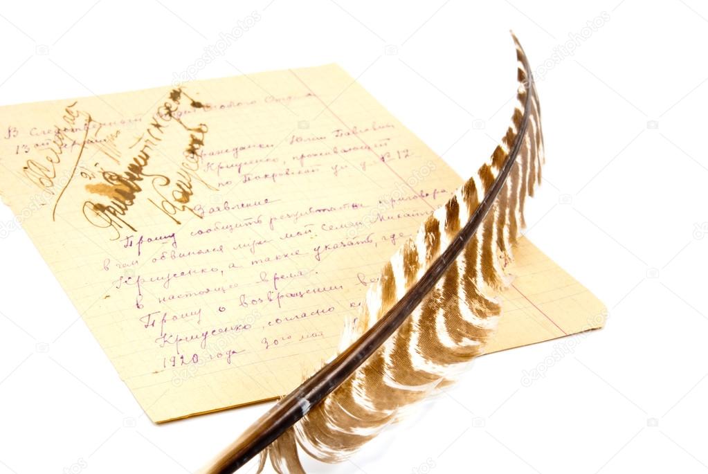 the quill and the paper sheet full of notes isolated on white ba