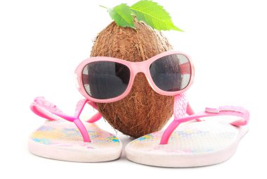 Coconut concept for travel agency with sunglasses and beachwear clipart