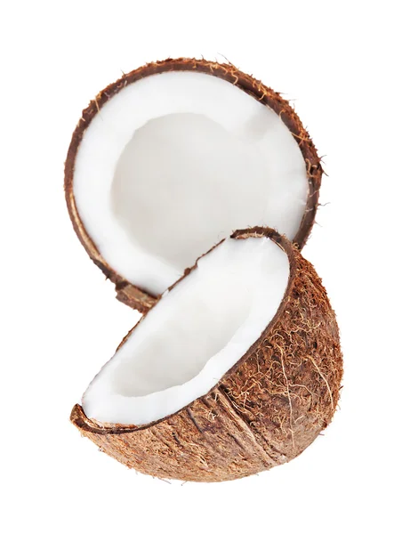 Две половинки кокоса, изолированные на белом — стоковое фото