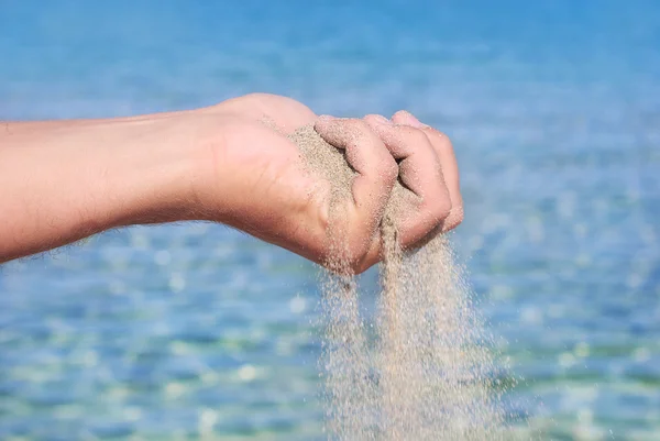 Sand pour away through the hands — Stock Photo, Image