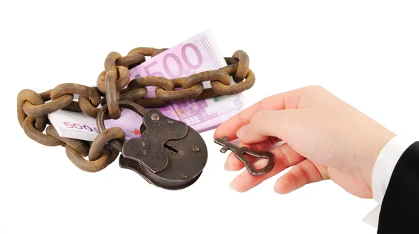 Money security concept - hand with key try to unlock money - iso — Stock Photo, Image